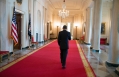 President Obama Walks in the Cross Hall