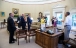 President Obama Talks with Staff in the Oval