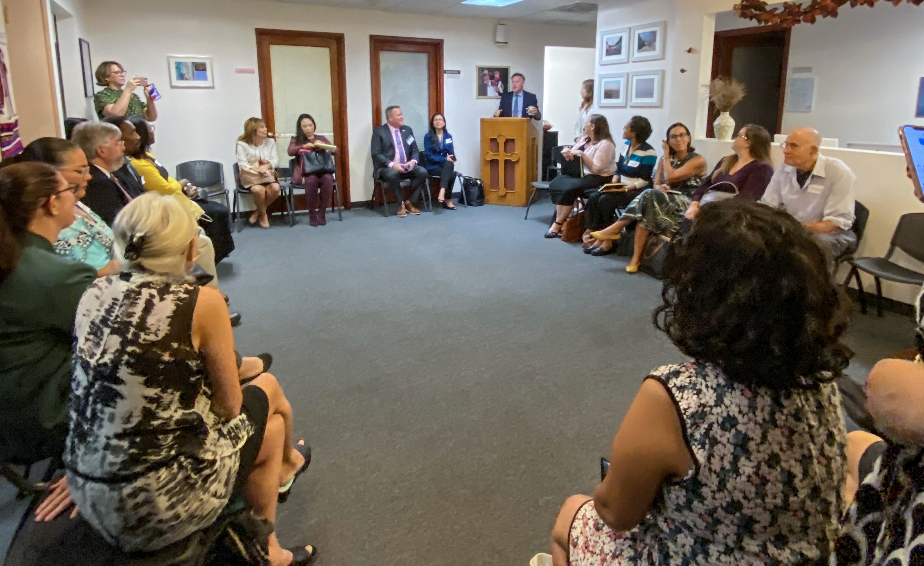 Photo: Group of people listening to speaker