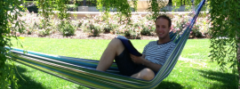 Student reading in hammock