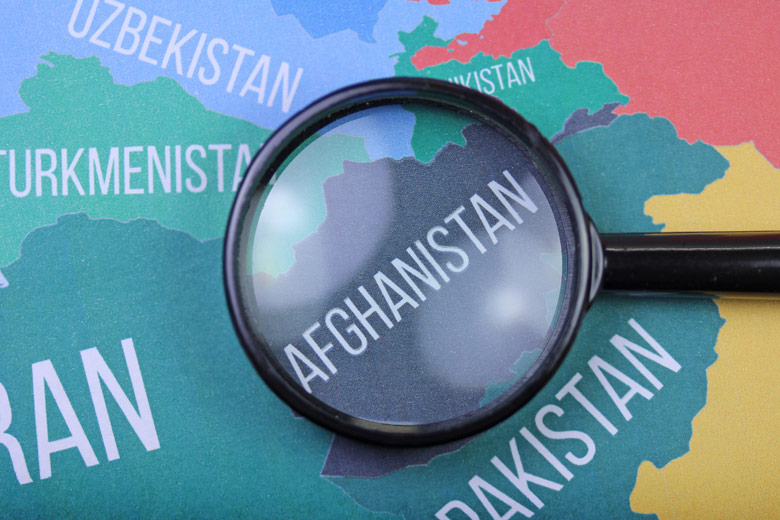 map with Afghanistan under the magnifying glass / Shutterstock/BelkaG