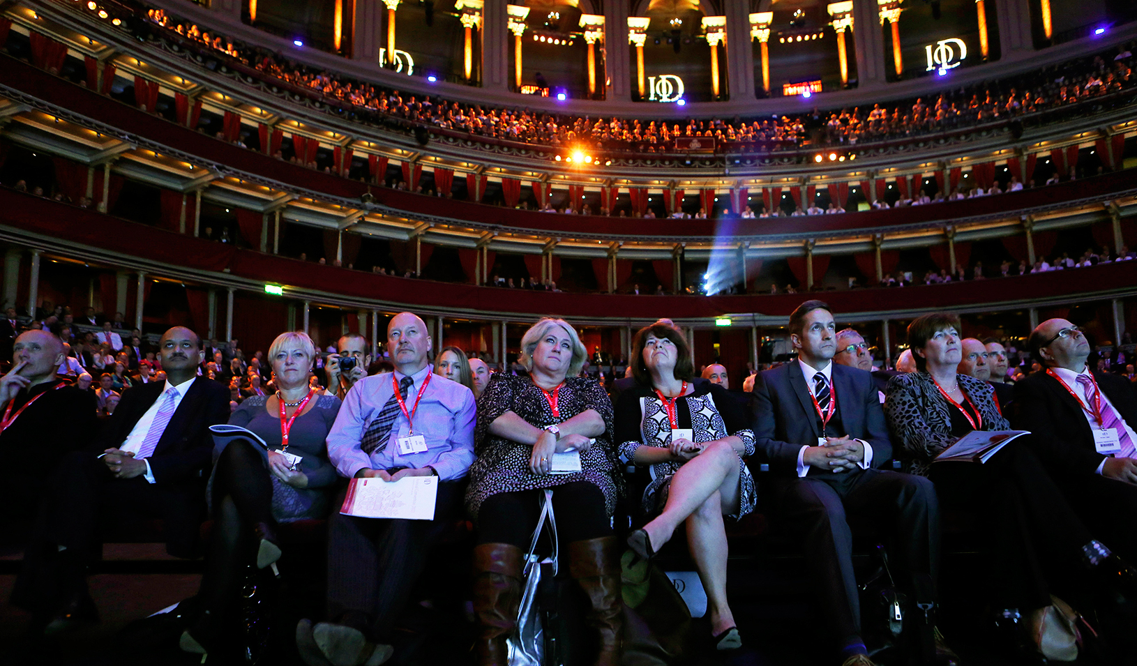 Members of the audience listen as Britain's Chancellor of the Exchequer George Osborne speaks at the Institute of Directors annual convention in London September 18, 2013. | REUTERS/Suzanne Plunkett 