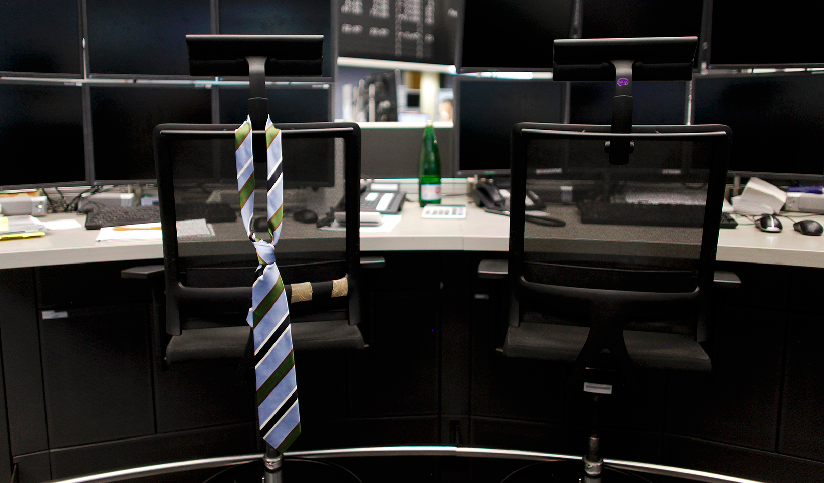 Tie hanging on the back of a chair in an empty office