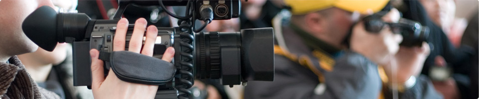 Photo of two film reels staggered next to each other.