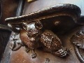 This carving of a cat playing the fiddle is located in Wells Cathedral in Wells, Somerset, England.