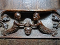 This 13th century misericord in Exeter Cathedral depicts a mermaid and a merman holding a drum or cymbal.