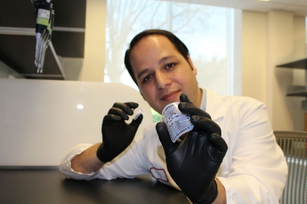 Scientist holding a biochip