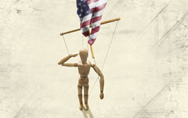 Hand with image of American flag manipulating a puppet