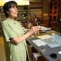 Cissie Dore Hill works on coordinating an exhibit coordinator at the Hoover Institution's library and archives; shown here in the Institution's preservation laboratory.