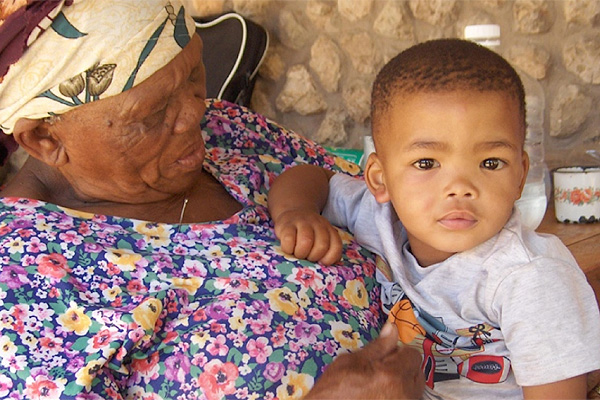 Khomani Bushman woman and her grandchild