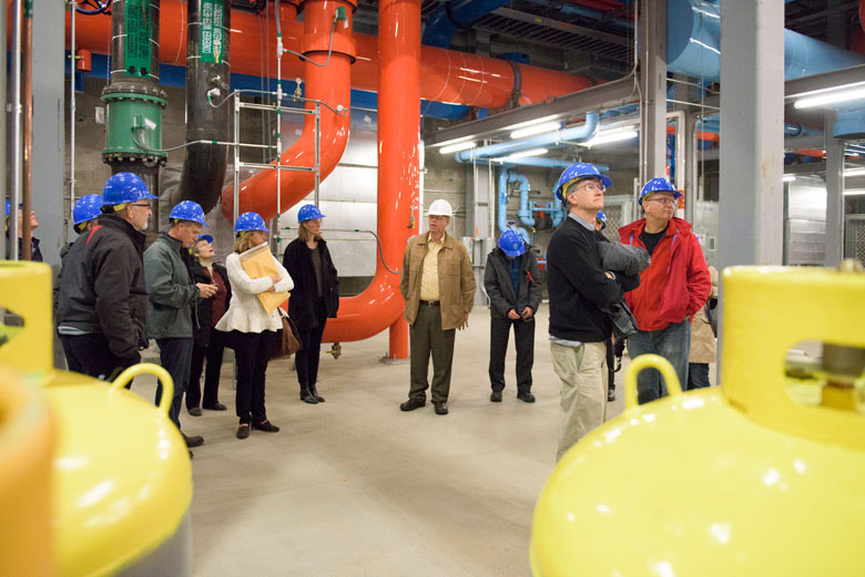 Members of the Faculty Senate in hard hats walking through the facility. / Photo: L.A. Cicero