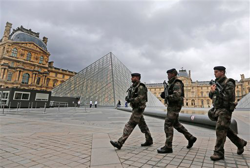 Soldiers patrolling Louvre courtyard