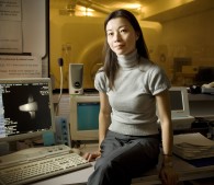 photo of woman sitting in front of medical computers