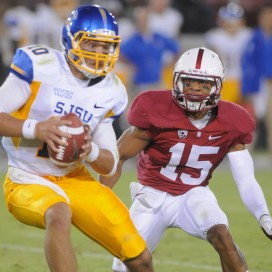 Senior nickle back Usua Amanam sacks San Jose State quarterback David Fales in the Aug. 31 season opener. The Cardinal win marked Amanam's first start and was powered by his fumble recovery and four tackles for loss, including two sacks. (SIMON WARBY/The Stanford Daily)