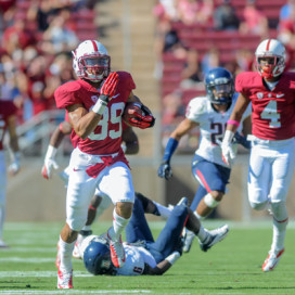 Sophomore Kelsey Young, shown scoring his first career touchdown on a fly sweep against Arizona, transitioned from running back to receiver last offseason. He's perhaps Stanford's fastest player on the field given the recent injury to sophomore receiver Ty Montgomery. (SIMON WARBY/The Stanford Daily)