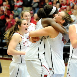 Senior forward Joslyn Tinkle (right) celebrates with junior forward Chiney Ogwumike (left) in her final game on campus. (MICHAEL KHEIR/The Stanford Daily)