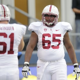 Fifth-year senior Khalil Wilkes (right) beat out senior Conor McFadden (left) for the starting center job, one of five position battles finalized by head coach David Shaw on Thursday. (STEPHEN BRASHEAR/isiphotos.com)