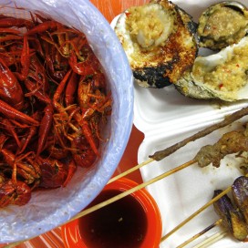 Although not pig intestines, these boiled crawfish, garlic grilled shellfish and grilled skewers at Shouning Road in Shanghai, China might not seem appealing to the casual eater. (Courtesy of Renjie Wong)