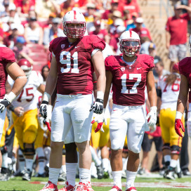 Fifth-year seniors Henry Anderson (91), A.J. Tarpley and David Parry (58) and junior Blake Martinez (4) must prepare for a unique Army rushing attack. (TRI NGUYEN/The Stanford Daily)