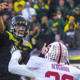 Heisman Trophy winner Marcus Mariota (left) and the Oregon Ducks may have lost the national title game to Ohio State, but they have been the face of the Pac-12's continued rise this season. (SAM GIRVIN/The Stanford Daily)
