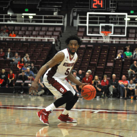 Senior Chasson Randle (right) is now Stanford's all-time leading scorer with 2,350 career points. He scored a game-high 24 points in the Cardinal's NIT semifinal win on Tuesday night. (RAHIM ULLAH/The Stanford Daily)