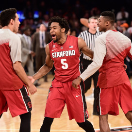 Senior guard Chasson Randle (center) scored 25 points in the swan song of his Cardinal career as Stanford overcame a Miami rally to win 66-64 in overtime to clinch the third NIT championship in program history. (BOB SOLOMON/Stanford Athletics)