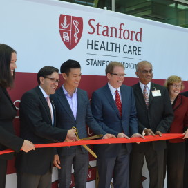 Administrative director Kate Surman MBA ’04, president and CEO of Stanford Health Care Amir Dan Rubin, Assemblymember Evan Low, Dean of Stanford's School of Medicine Lloyd B. Minor, vice president of Cancer and Cardiovascular Service Lines Sridhar Seshadri, director of the Stanford Cancer Institute Beverly Mitchell and Assemblymember Kansen Chu cut the ribbon for Stanford Health Care’s South Bay Cancer Center on June 26. (ALINA ABIDI/The Stanford Daily)