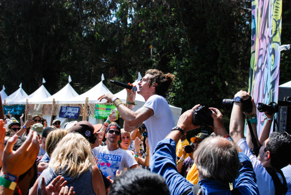 David Shaw getting a closer look at his audience. He really played to the audience, staying on the very edge of the stage, and even climbing up onto the barrier. RAHIM ULLAH/The Stanford Daily