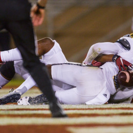 Junior Francis Owusu (back) makes a third-quarter touchdown catch on the back of UCLA safety Jaleel Wadood in the third quarter of Stanford's 56-35 rout over No. 18 UCLA. The catch, which came off of a reverse pass from the Wildcat, trended nationally on Twitter and has drawn comparisons to Odell Beckham, Jr.'s once-in-a-generation catch from last season. (SAM GIRVIN/The Stanford Daily)