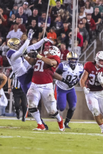 Senior offensive guard Joshua Garnett (center) made a highlight-reel block in the second quarter, paving the way for a 15-yard gain by fullback Daniel Marx. Garnett and the offensive line have been stellar for the Cardinal, allowing only 1.43 sacks per game while allowing the rush game to average 5.04 yards per carry (SAM GIRVIN/ The Stanford Daily).