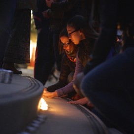 Participants set their candles in a single line along the White Plaza steps.