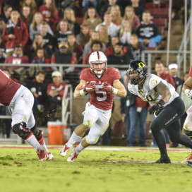 Although Christian McCaffrey (center) added 244 all-purpose yards to become Stanford's all-time leader in single-season all-purpose yards and passed Toby Gerhart for the program record with his eighth straight 100-yard rushing game, Stanford still fell in a heartbreaker to the Ducks, 38-36. (SAM GIRVIN/The Stanford Daily)