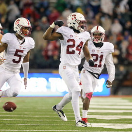 Freshman nickelback Quenton Meeks (center) celebrates after his second interception of the night against Washington State, which set Stanford up with great field position to eventually take a 30-28 lead on a 19-yard Conrad Ukropina field goal. He also set up a Stanford touchdown drive in the third quarter with his first pick. On this interception, Meeks identified that Washington State quarterback Luke Falk was going to throw a screen pass and jumped the route for an easy takeaway. (BOB DREBIN/isiphotos.com)