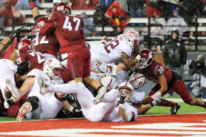 Fifth-year senior running back Remound Wright (center) scores the first touchdown of the game in the third quarter on a 2-yard run to reduce Stanford's deficit to 15-10. After being held to 3 points and just 85 total yards in the first half, Stanford scored on its first four drives of the second half. (BOB DREBIN/isiphotos.com)