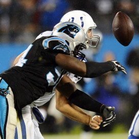 Andrew Luck '12 (behind) struggled Monday night against the Panthers, throwing 3 picks and notching a fumble. The Colts would go on to lose 29-26 in overtime.