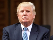 WASHINGTON, DC - JULY 23:  Donald Trump listens at the Trump International Hotel Washington, D.C Groundbreaking Ceremony at Old Post Office on July 23, 2014 in Washington, DC.  (Photo by Paul Morigi/WireImage)