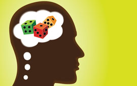 Silhouette of a head with thought bubble in the brain containing dice