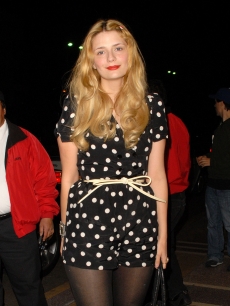 Mischa Barton smiles as she heads in to the She & Him concert featuring Zooey Deschanel at the El Rey, Los Angeles, March 25, 2010