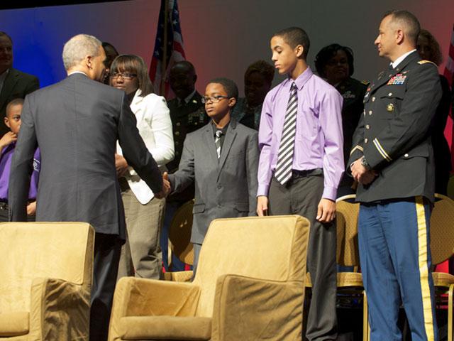 Attorney General Holder greets a military family in attendence. 