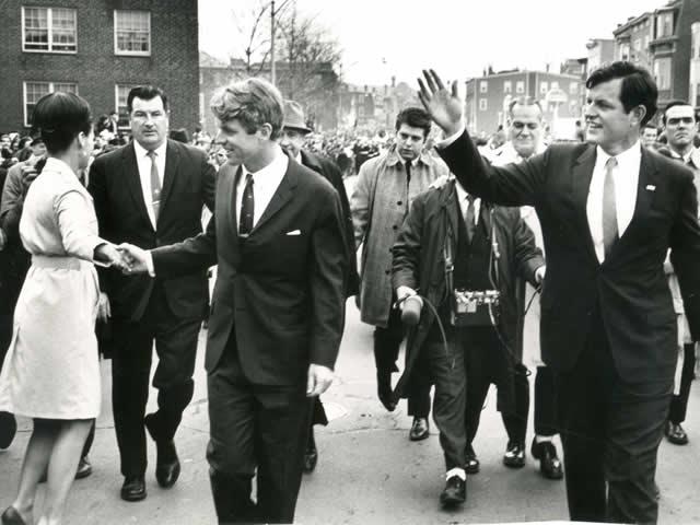 Attorney General Robert F. Kennedy walks with his brother Edward M. Kennedy.