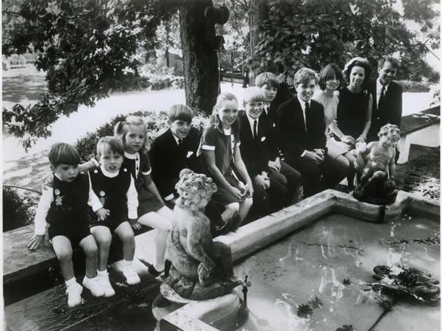 Attorney General and Mrs. Kennedy and their children pose for a portrait.