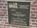 Plaque marking the home of the National Center for Missing and Exploited Children and the location of the press conference.