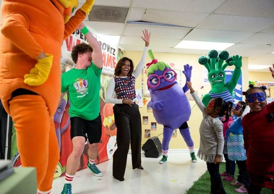 First Lady Michelle Obama joins children for a Super Sprowtz show, a "Let's Move!" event at La Petite Academy child care center in Bowie, Md., Feb. 27, 2014.