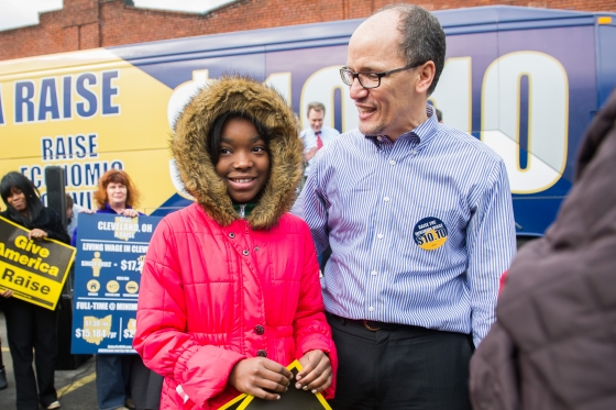 Secretary of Labor Tom Perez with Jesseca Hudson, 11, of Cleveland after talking at the SEIU District 1199 building in Cleveland on Friday, March 28, 2014.