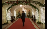 President Obama Walks Through The Ground Floor Corridor