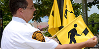 U.S. City Thinks Having Pedestrians Carry Flags Will Keep Them Safe