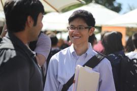 Student talking with recruiter at career fair