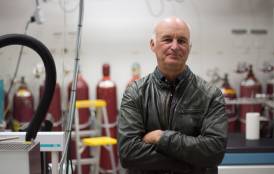 Page Chamberlain standing in a research lab