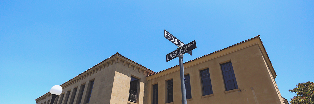 Photo of Cubberley Education Building and a street sign of Escondido and Lasuen Mall intersection