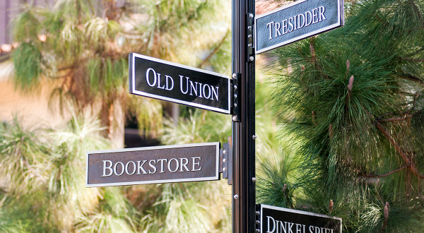 Campus direction guidepost signs (to Bookstore, Tresidder, etc.)
